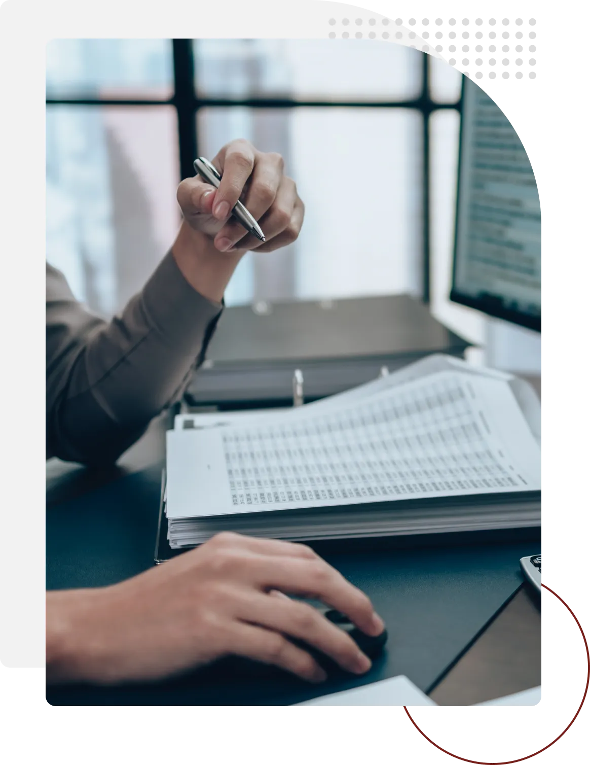 A person is writing on the keyboard of a computer.